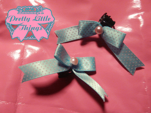 Tiny blue clasp bow